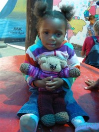 Child in Namibia receives Mother Bear Project bear