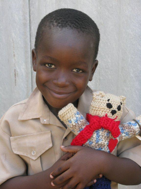 Child with Donated Bear